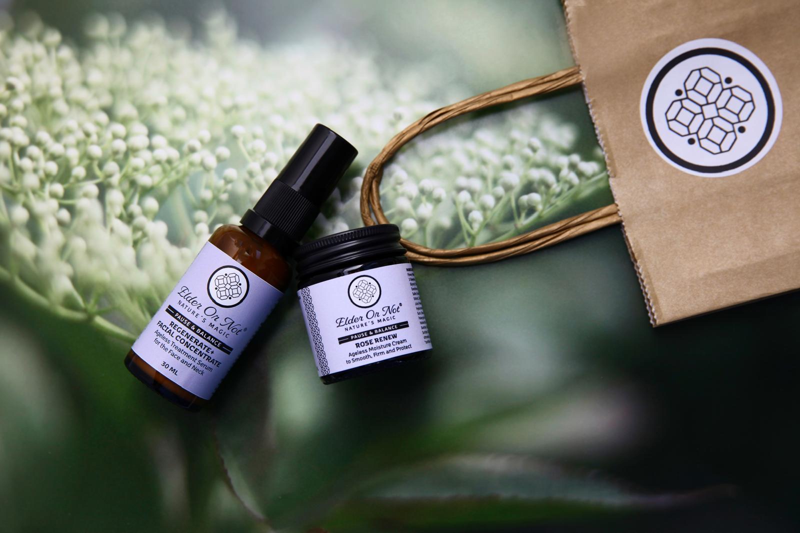Regenerate plus facial concentrate and rose renew with bag and logo elderflower buds in the background