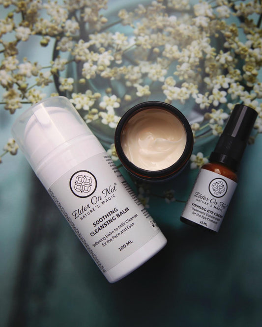 Three skincare products on a textured surface with floral background